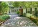 Spacious wooden backyard deck with an adjacent sunroom perfect for outdoor entertaining at 220 Blackberry Trl, Concord, NC 28027