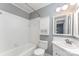Bathroom features tile shower, white vanity, and medicine cabinet at 220 Blackberry Trl, Concord, NC 28027
