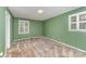 Bedroom with green walls, carpeted floors and windows with shutters at 220 Blackberry Trl, Concord, NC 28027