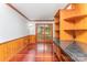 Dining area with wood paneled walls, hardwood floors, and glass patio doors at 220 Blackberry Trl, Concord, NC 28027