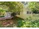 Quaint side exterior with cozy wooden deck with screened in porch and mature greenery at 220 Blackberry Trl, Concord, NC 28027
