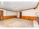 Large living room with fireplace, built in shelving and wood paneling at 220 Blackberry Trl, Concord, NC 28027