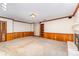 Large living room with fireplace, built in shelving and wood paneling at 220 Blackberry Trl, Concord, NC 28027