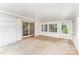 Enclosed sunroom with white trim, door to the outside, and double glass doors at 220 Blackberry Trl, Concord, NC 28027