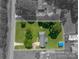Aerial view of the property with lot lines outlined in a wooded neighborhood, including a pool and shed at 233 Reliance Rd, Kings Mountain, NC 28086