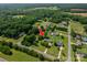 Aerial view of the property nestled in a wooded neighborhood with lush greenery at 233 Reliance Rd, Kings Mountain, NC 28086