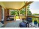 Relaxing back porch with comfortable seating, perfect for outdoor entertaining and enjoying the serene backyard at 233 Reliance Rd, Kings Mountain, NC 28086