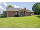 Beautifully maintained backyard with a brick home, complete with covered deck, offering space and privacy at 233 Reliance Rd, Kings Mountain, NC 28086