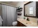 Well-maintained bathroom featuring a vanity, mirror, and shower with curtain, designed for everyday convenience at 233 Reliance Rd, Kings Mountain, NC 28086