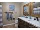 Bathroom featuring double sinks with a wood frame mirror and nautical-themed decor at 233 Reliance Rd, Kings Mountain, NC 28086