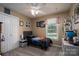 Cozy bedroom with carpeted floors, a ceiling fan, and a large window for plenty of natural light at 233 Reliance Rd, Kings Mountain, NC 28086