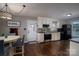 Well-lit kitchen with stainless steel appliances, white cabinets, and hardwood flooring, adjacent to an eat-in area at 233 Reliance Rd, Kings Mountain, NC 28086