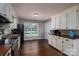 Well-lit kitchen features white cabinets, wood countertops, and stainless steel appliances, great for cooking and entertaining at 233 Reliance Rd, Kings Mountain, NC 28086