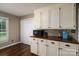 This spacious kitchen has white cabinets with dark hardware, a dark countertop, and modern appliances for your culinary needs at 233 Reliance Rd, Kings Mountain, NC 28086