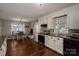Charming kitchen featuring white cabinets, stainless steel appliances, and a cozy dining area with a view from the window at 233 Reliance Rd, Kings Mountain, NC 28086