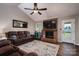 Cozy living room with a brick fireplace, plush leather sofas, and a decorative rug, creating a warm atmosphere at 233 Reliance Rd, Kings Mountain, NC 28086