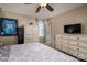 Comfortable main bedroom with a decorative cabinet, a ceiling fan, and a light gray colored bed, offering a relaxing retreat at 233 Reliance Rd, Kings Mountain, NC 28086