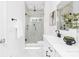 Modern bathroom with glass-enclosed shower, white marble tile, and black hardware at 24578 Blue Heron Cir # 407, Lancaster, SC 29720