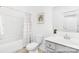 Bathroom featuring a shower tub combination, a white vanity and white decor at 24578 Blue Heron Cir # 407, Lancaster, SC 29720