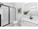 Modern bathroom with glass shower, white vanity, black fixtures, and neutral decor at 24578 Blue Heron Cir # 407, Lancaster, SC 29720