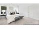 Bright bedroom with a decorative headboard, neutral bedding, and a comfortable bench at 24578 Blue Heron Cir # 407, Lancaster, SC 29720