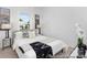 Bright bedroom with a large window, neutral decor, and stylish lamps at 24578 Blue Heron Cir # 407, Lancaster, SC 29720