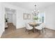 Elegant dining room featuring modern decor, a stylish chandelier, and ample natural light at 24578 Blue Heron Cir # 407, Lancaster, SC 29720