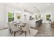 Eat-in kitchen and dining with open layout and lots of natural light and modern decor at 24578 Blue Heron Cir # 407, Lancaster, SC 29720
