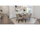 Formal dining area with elegant wainscoting, chandelier, and hardwood floors at 24578 Blue Heron Cir # 407, Lancaster, SC 29720