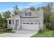 Charming home with stone accents, a welcoming porch, and a two-car garage at 24578 Blue Heron Cir # 407, Lancaster, SC 29720