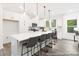 Bright kitchen boasts a large island, stylish pendant lights, and stainless steel appliances at 24578 Blue Heron Cir # 407, Lancaster, SC 29720
