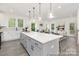 Kitchen and eat-in kitchen feature an expansive island perfect for entertaining and casual dining at 24578 Blue Heron Cir # 407, Lancaster, SC 29720