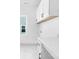 Well-lit laundry room featuring white cabinets, sleek countertops, and modern fixtures at 24578 Blue Heron Cir # 407, Lancaster, SC 29720