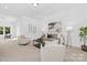 Bright living room with modern furniture, neutral colors, and large windows with natural light at 24578 Blue Heron Cir # 407, Lancaster, SC 29720