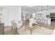 Open floor plan with living room and kitchen featuring modern cabinets and hardwood floors at 24578 Blue Heron Cir # 407, Lancaster, SC 29720