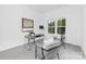 Bright home office with a desk, stylish chairs, and large windows with outdoor views at 24578 Blue Heron Cir # 407, Lancaster, SC 29720