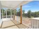 Spacious screened porch with wood flooring and peaceful views of the surrounding nature at 24578 Blue Heron Cir # 407, Lancaster, SC 29720