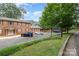 Cranbrook community, featuring a well-maintained building with ample parking and beautiful curb appeal at 2607 Vail Ave, Charlotte, NC 28207