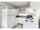 Efficient kitchen featuring appliances and a washer/dryer combo at 2607 Vail Ave, Charlotte, NC 28207