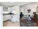 Cozy living room, seamlessly connected to the dining area and kitchen at 2607 Vail Ave, Charlotte, NC 28207