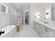 Modern bathroom with double vanity, marble countertops, glass shower, and standalone tub at 2921 Windsor Ave, Charlotte, NC 28209