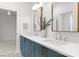 Bathroom with double sink, marble countertop, gold hardware and fixtures, and tile flooring at 2921 Windsor Ave, Charlotte, NC 28209