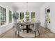 Elegant dining room with natural light, a wooden table and seating for Gathering gatherings at 2921 Windsor Ave, Charlotte, NC 28209