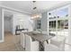 Elegant dining room with a large window, modern lighting, and a stylish table setting for sophisticated gatherings at 2921 Windsor Ave, Charlotte, NC 28209