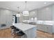 Modern kitchen with a large island, pendant lights, and sleek appliances, perfect for culinary enthusiasts at 2921 Windsor Ave, Charlotte, NC 28209