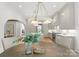 Bright and airy kitchen with modern appliances, a large island, and a stylish chandelier at 2921 Windsor Ave, Charlotte, NC 28209