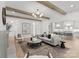 Spacious living room with wooden beams, hardwood floors, and a modern design at 2921 Windsor Ave, Charlotte, NC 28209
