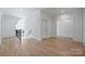 Open loft area with hardwood floors and natural light, offering a flexible space at 2921 Windsor Ave, Charlotte, NC 28209