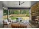 Outdoor patio with a brick fireplace and comfortable seating, great for outdoor living at 2921 Windsor Ave, Charlotte, NC 28209