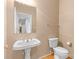 Well-maintained bathroom featuring a pedestal sink, toilet, and simple yet functional design at 3213 Strawberry Rd, Matthews, NC 28104